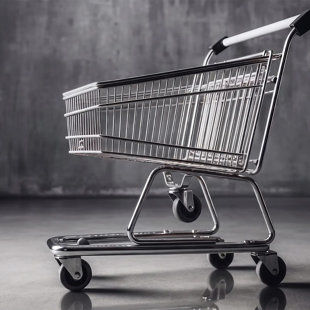 A shopping cart with 5th wheel in its middle, against a dark background